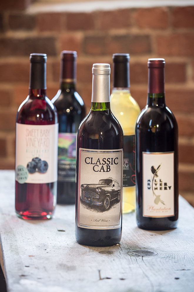 classic cab, mill river, and other local wine bottles.